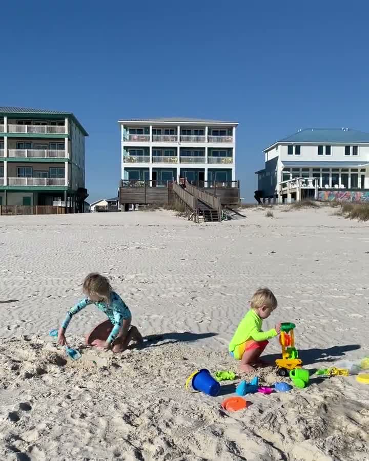 Children building sandcastles on the beach on the Alabama Gulf Coast