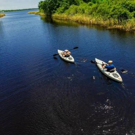 Kayaking on a calm coastal lagoon behind the dunes on the Alabama Gulf Coast