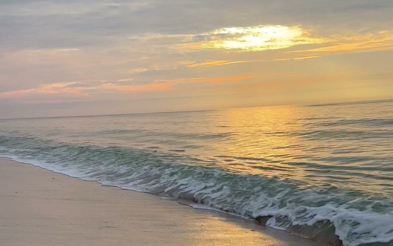 Sunset over the Gulf from the beach in Gulf Shores, Alabama, in the winter off-season